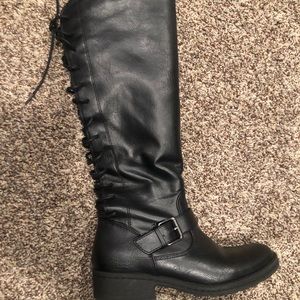 Black leather boots with ties in the back. Size 6